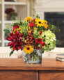 Dahlia, Hydrangea & Berries Centerpiece in Red and Yellow.