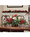 Holly, Pine & Berries Artificial Holiday Centerpiece in metal planter, by Petals.